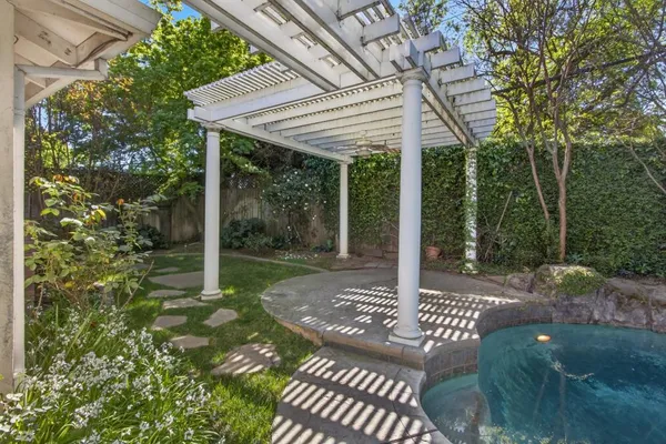 a view of a patio with a table chairs and floor