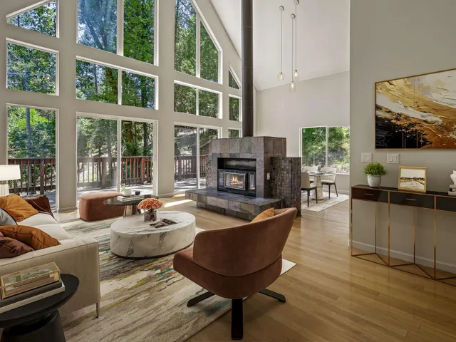 a living room with fireplace furniture and a flat screen tv