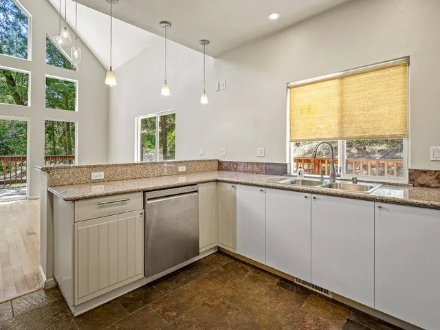 a kitchen with a sink and cabinets