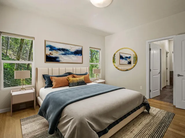 a bathroom with a granite countertop sink a mirror and shower