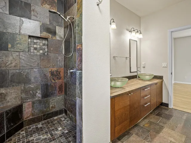a bathroom with a bathtub and window