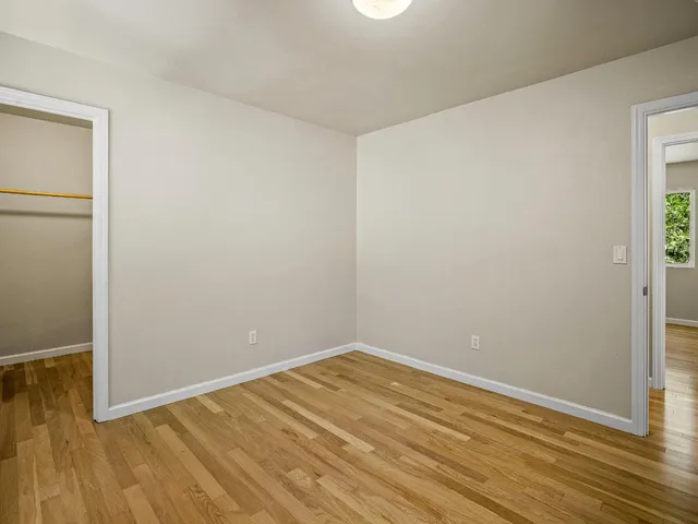 a bathroom with a granite countertop sink a mirror and a