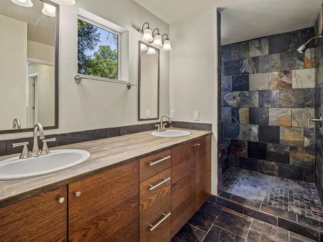 a view of a room with wooden floor