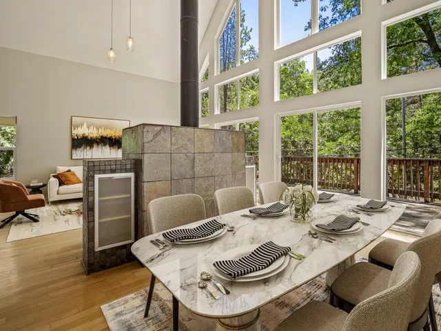 a dining room with furniture and wooden floor