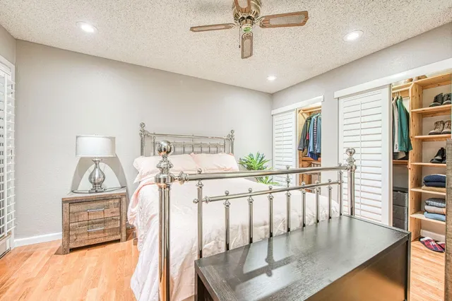 a bedroom with furniture and a chandelier