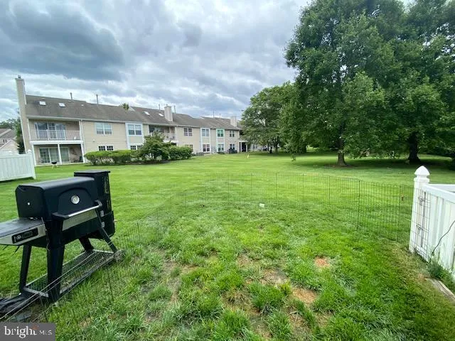 a view of a chair and table in the garden