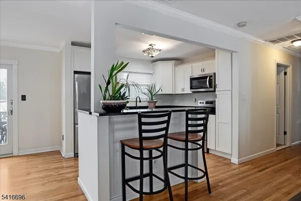 a kitchen with a table and chairs in it