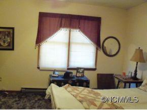 6 B Riverchase Sylva, NC 28779 - Photo 11 of 12 a bedroom with a bed and a window