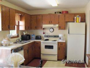 6 B Riverchase Sylva, NC 28779 - Photo 6 of 12 a kitchen with a refrigerator a stove and a sink