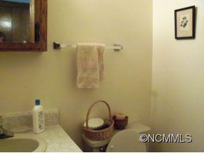 6 B Riverchase Sylva, NC 28779 - Photo 7 of 12 a bathroom with a sink and a mirror