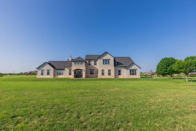 a view of a livingroom with furniture and stairs