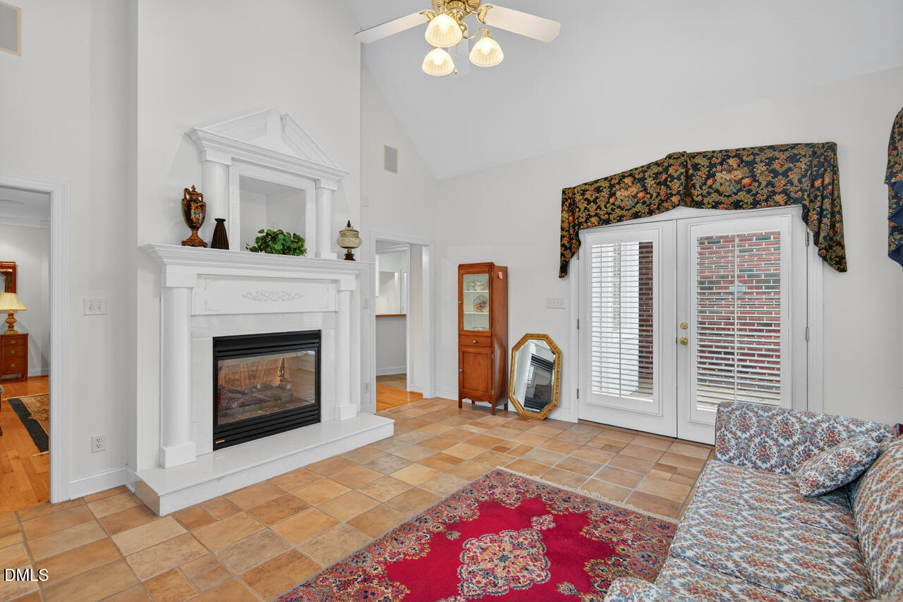 2204 Hayfield Drive Durham, NC 27705 - Photo 16 of 56 a living room with a fireplace furniture and a window