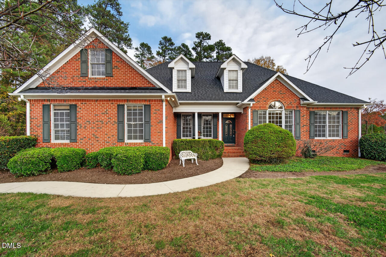 2204 Hayfield Drive Durham, NC 27705 - Photo 2 of 56 a front view of a house with a yard and garage
