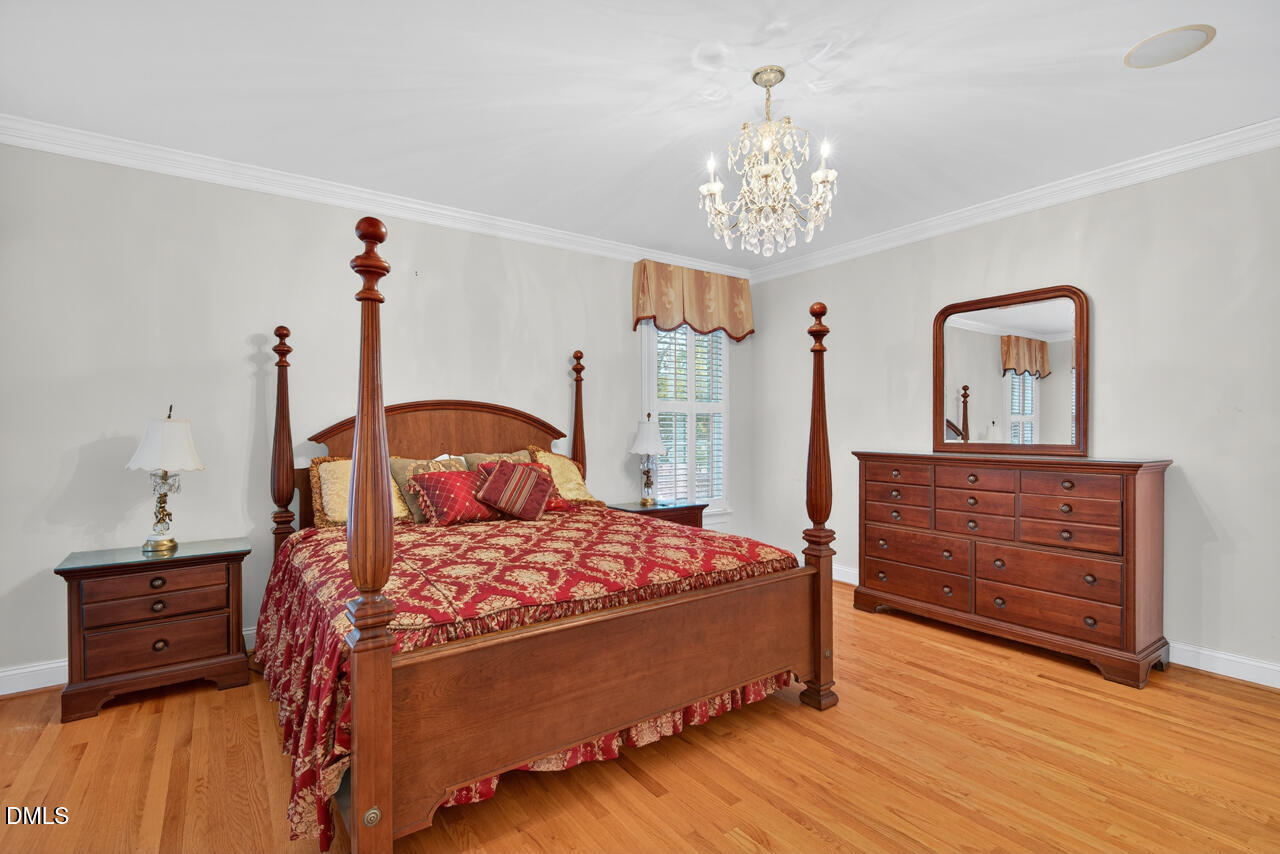 2204 Hayfield Drive Durham, NC 27705 - Photo 21 of 56 a bedroom with a bed and a dresser