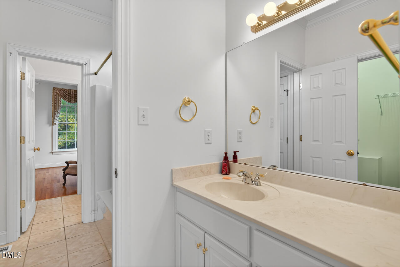 2204 Hayfield Drive Durham, NC 27705 - Photo 26 of 56 a bathroom with a sink and a mirror