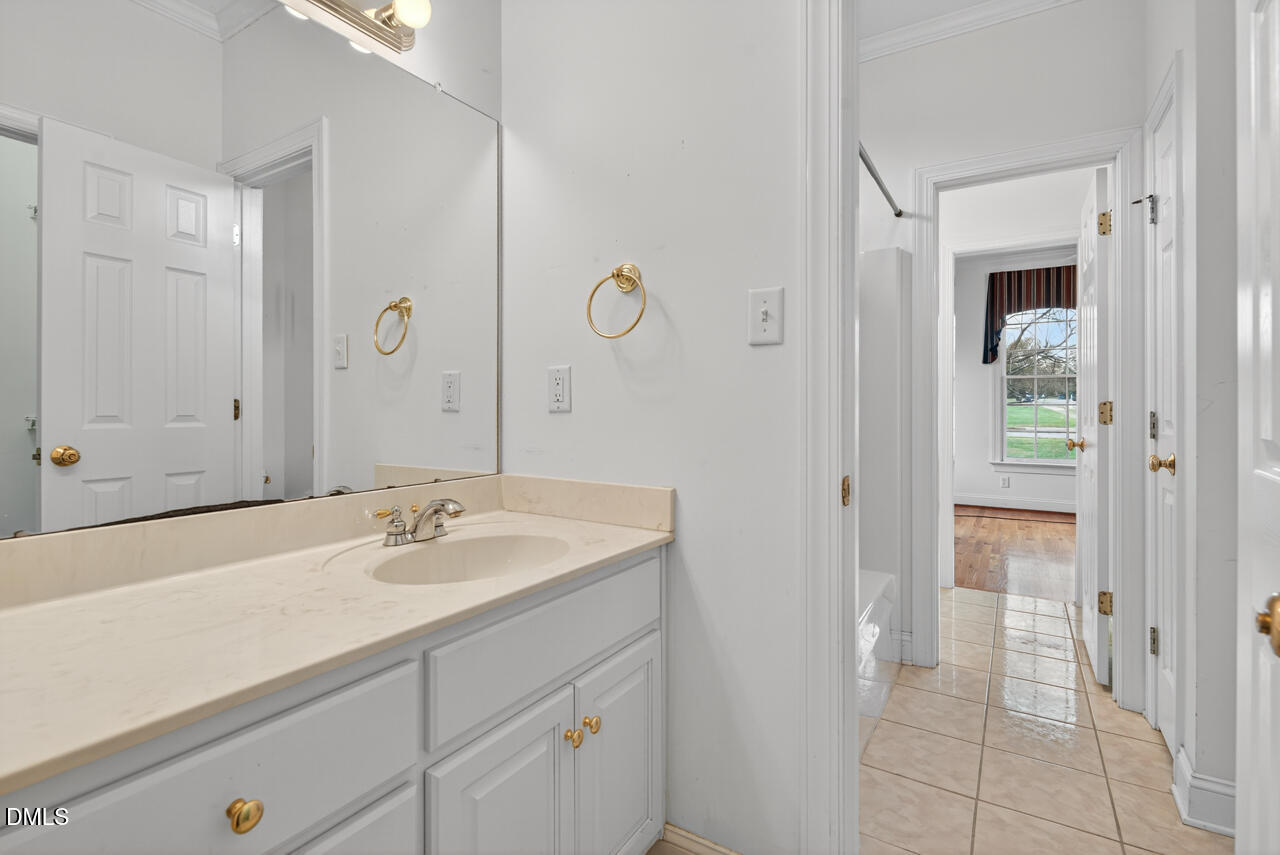 2204 Hayfield Drive Durham, NC 27705 - Photo 30 of 56 a bathroom with a sink and a mirror