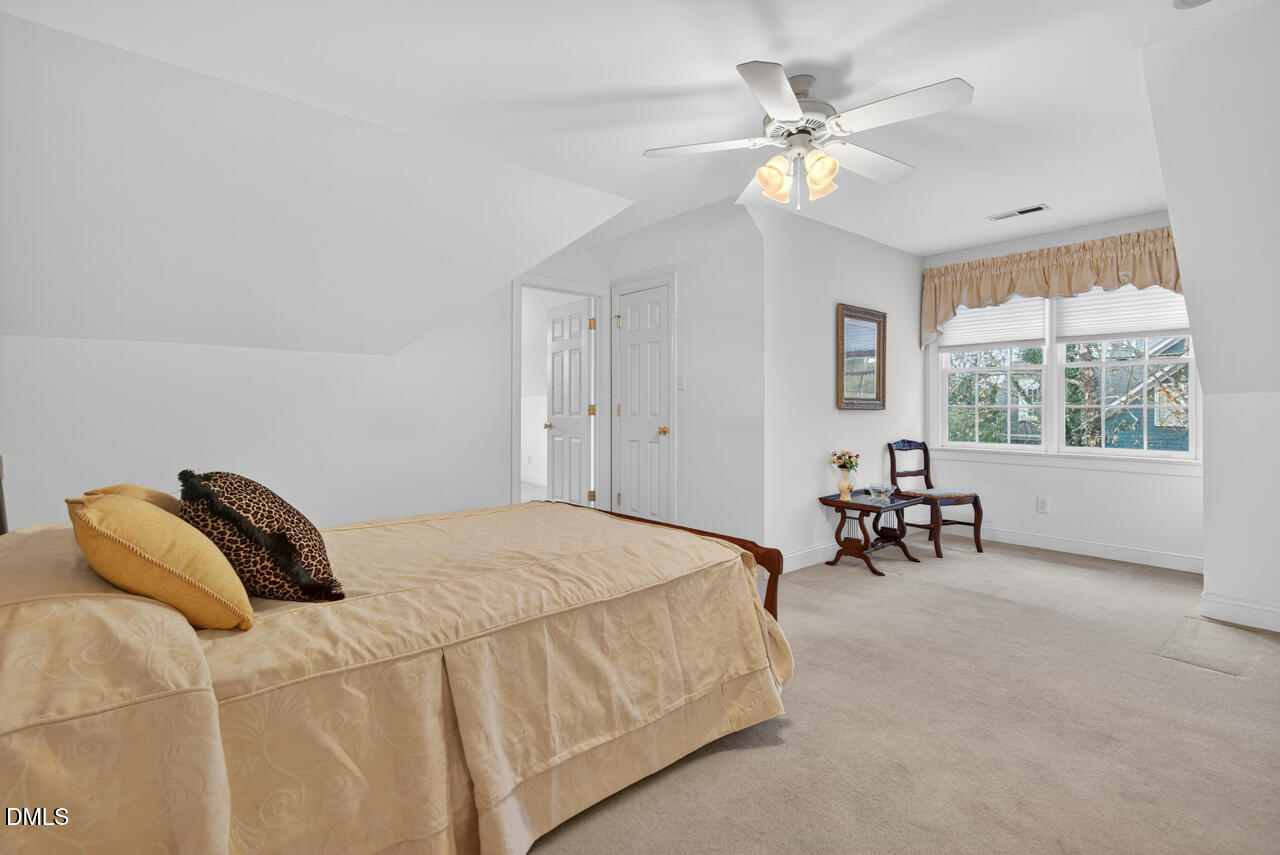 2204 Hayfield Drive Durham, NC 27705 - Photo 34 of 56 a bedroom with a bed and a table
