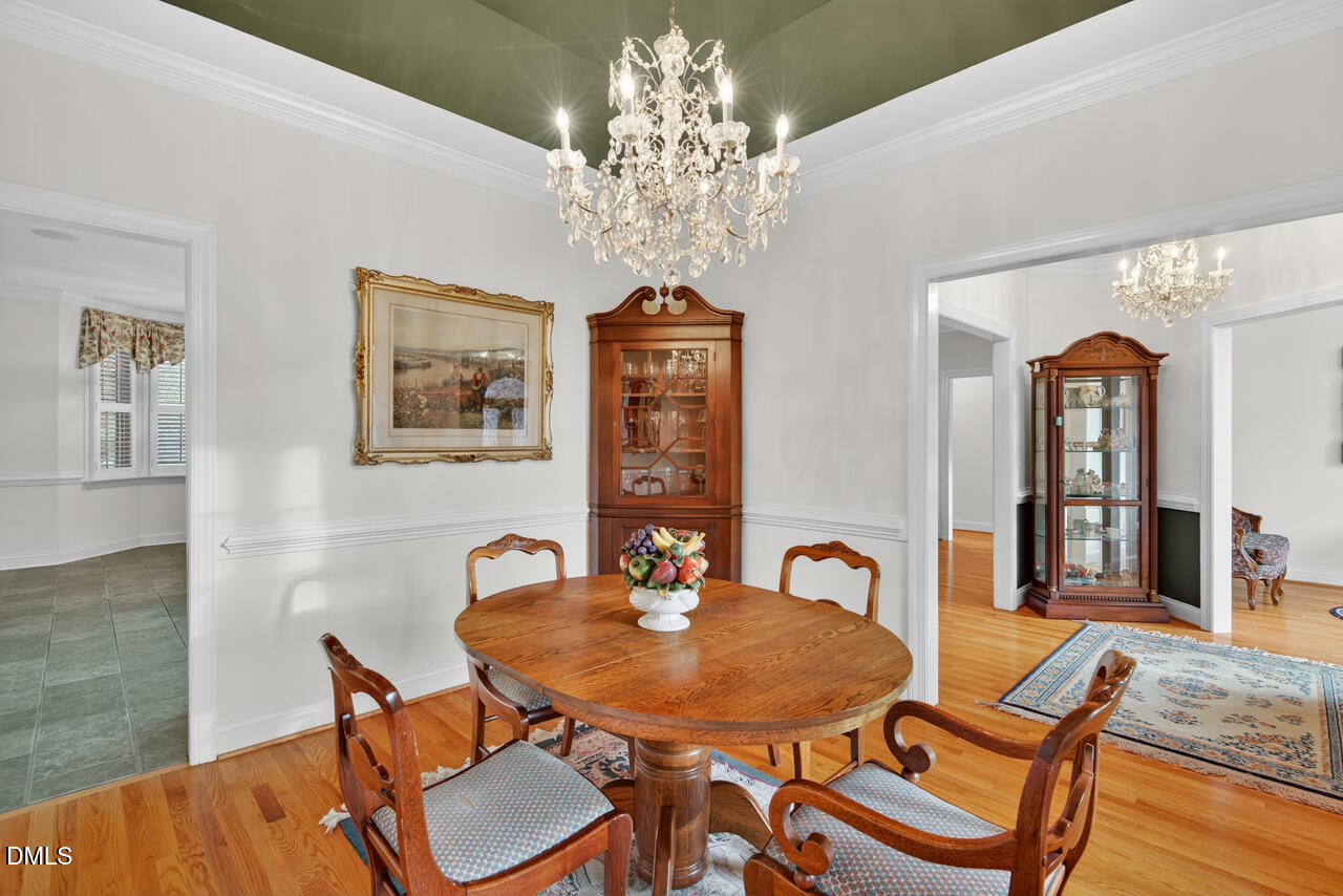 2204 Hayfield Drive Durham, NC 27705 - Photo 6 of 56 a view of a dining room with furniture and chandelier