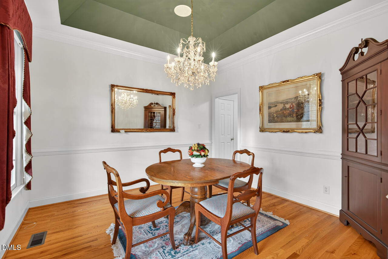 2204 Hayfield Drive Durham, NC 27705 - Photo 8 of 56 a dining room with furniture and chandelier