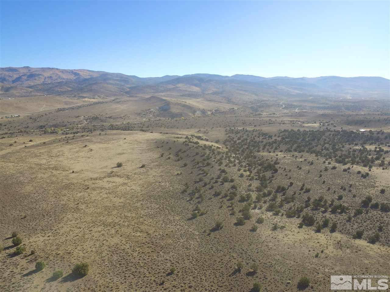 0 Yellow Tail Reno, NV 89510 - Photo 2 of 7 a view of a dry field with mountains in the background