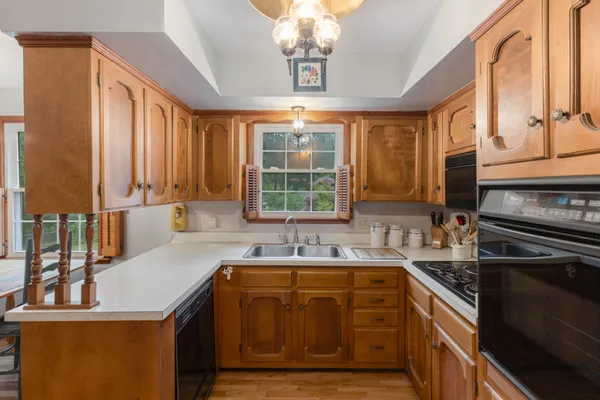 a kitchen that has a sink and a stove in it