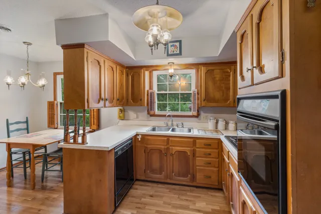 a kitchen with a sink stove and microwave