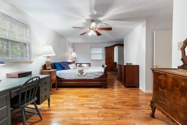 a living room with fireplace furniture and a chandelier