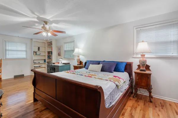 a bed room with a bed and a chandelier