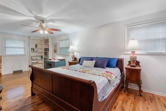 a bed room with a bed and a chandelier