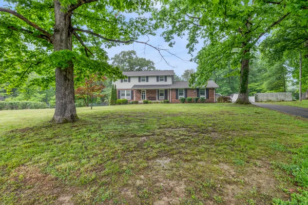 a view of a house with a big yard