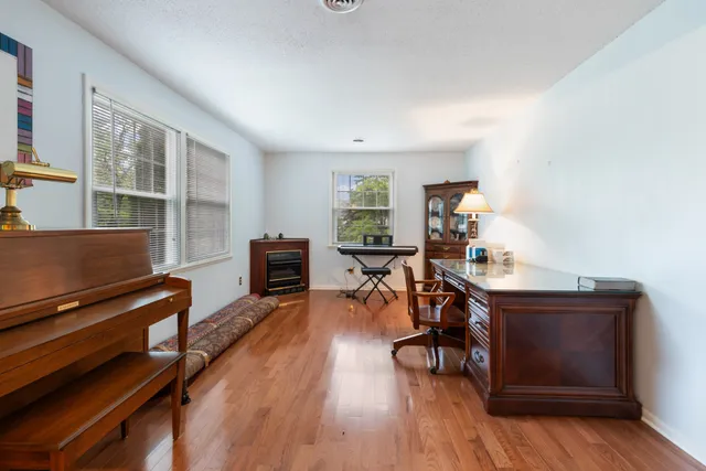 a view of a livingroom with furniture and a workspace