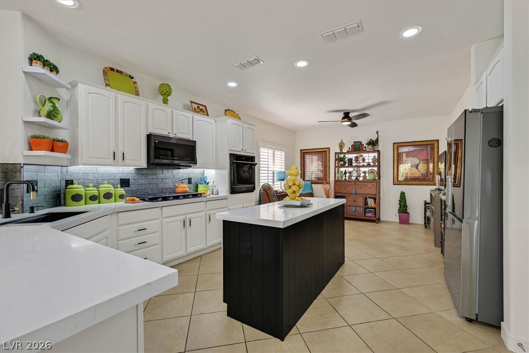 2228 Waterton Rivers Drive Henderson, NV 89044 - Photo 11 of 57 Re-imagined kitchen with Quartz counters, Island, New Appliances included!