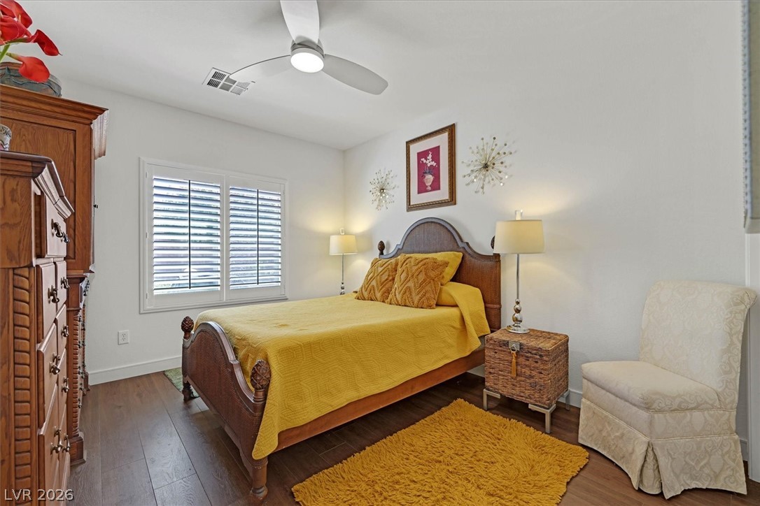 2228 Waterton Rivers Drive Henderson, NV 89044 - Photo 39 of 57 2nd Bedroom with Wide Plank wood floors. Shutters and Ceiling Fan.