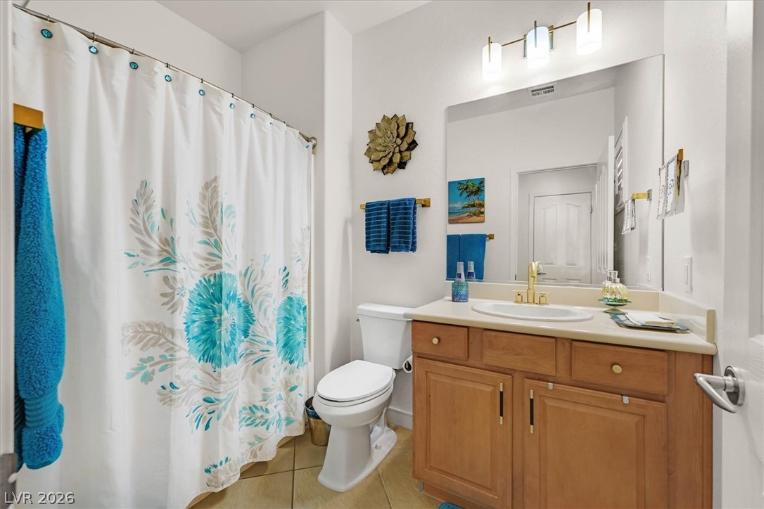 2228 Waterton Rivers Drive Henderson, NV 89044 - Photo 41 of 57 2nd Bathroom perfectly situated for guests. Tub/Shower and updated light fixtures and hardware.