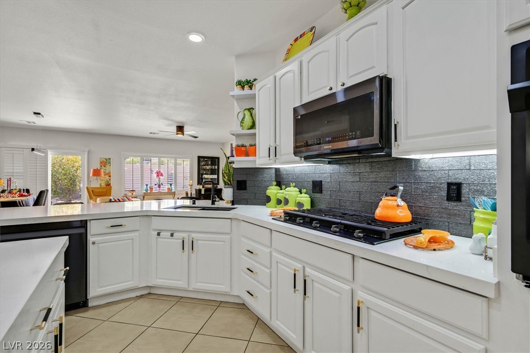 2228 Waterton Rivers Drive Henderson, NV 89044 - Photo 7 of 57 Gorgeous cooktop and custom tile backsplash.