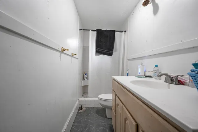 a room with furniture and a baby crib