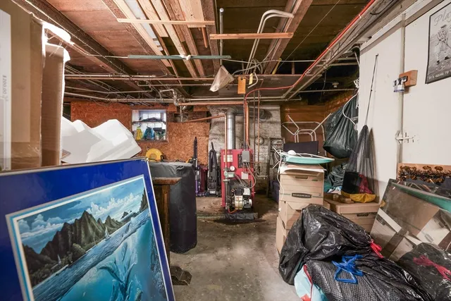 a utility room with dryer washer and other items