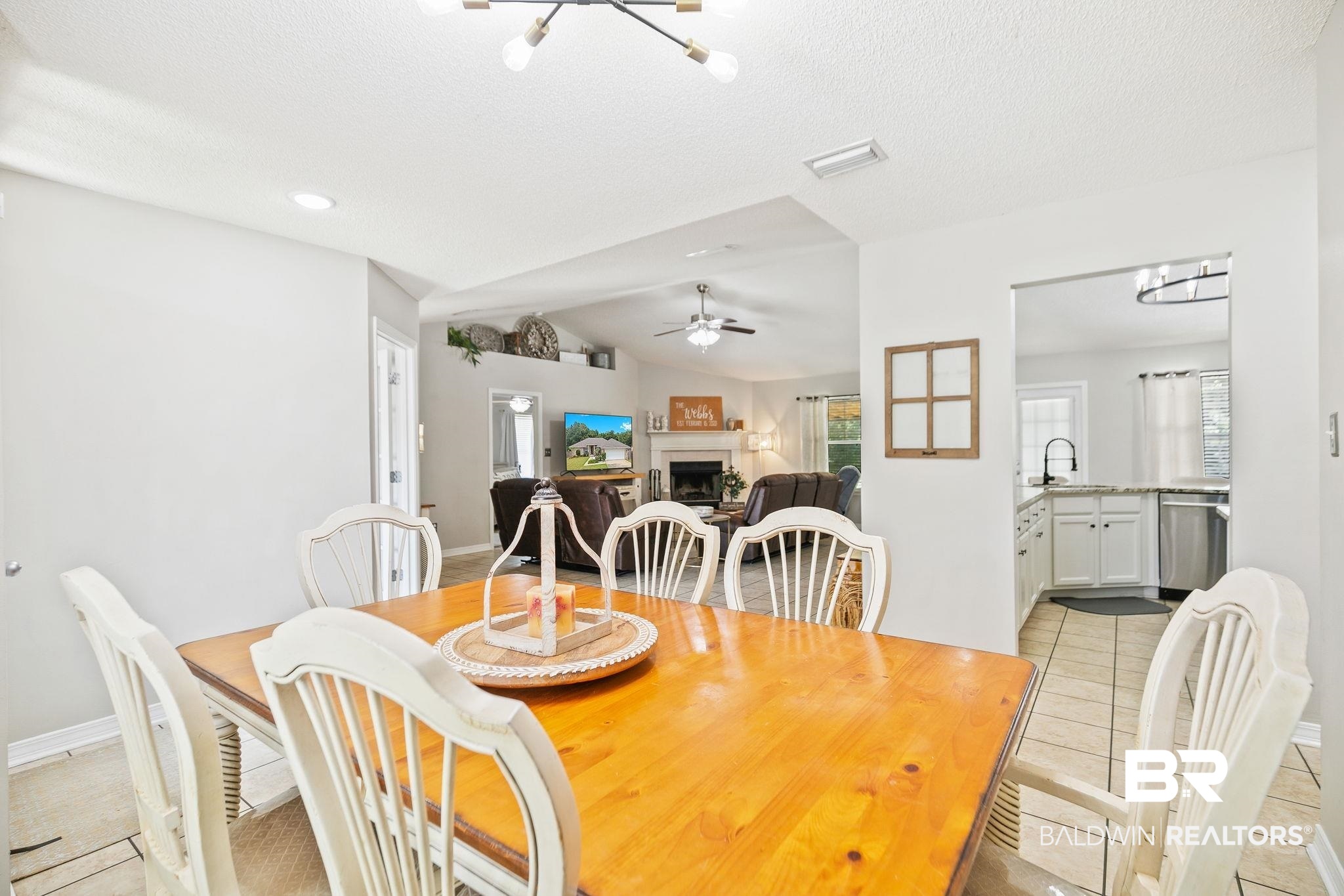 28246 Turkey Branch Drive Daphne, AL 36526 - Photo 8 of 41 Tiled dining space with ceiling fan, sink, a textured ceiling, and vaulted ceiling