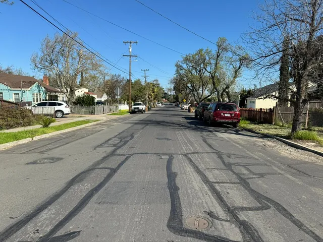 a view of a street with cars