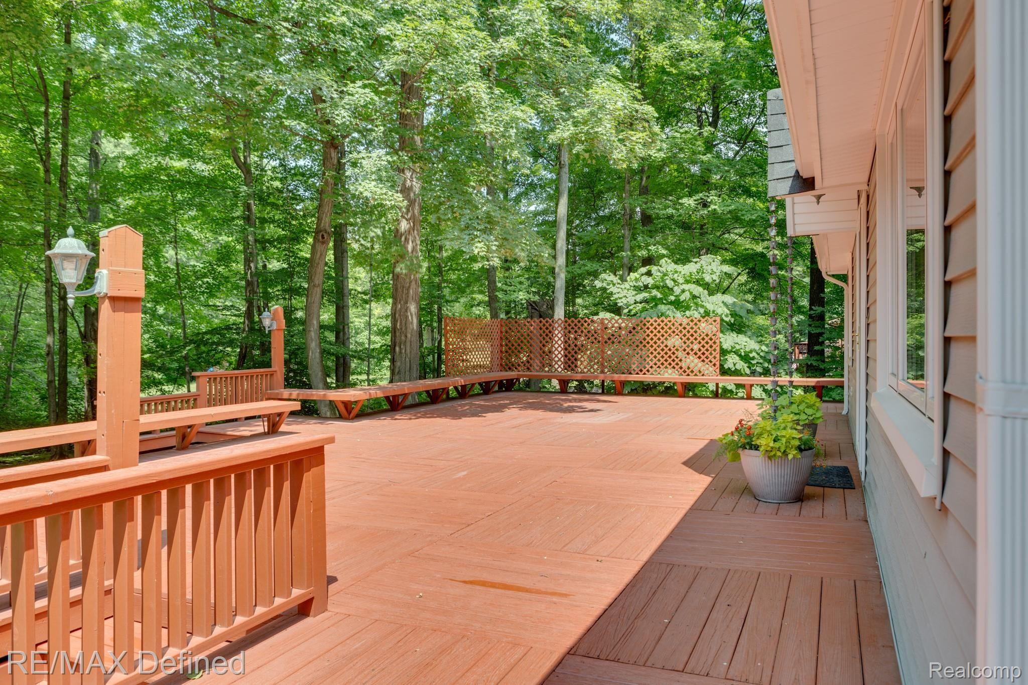 66050 Campground Road Washington, MI 48095 - Photo 7 of 31 Large deck on front of home is great for entertaining