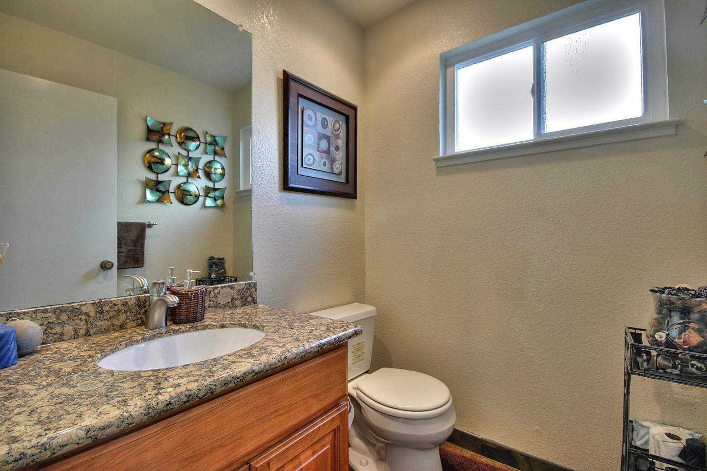 761 Superior Road Milpitas, CA 95035 - Photo 14 of 41 a bathroom with a granite countertop sink and a mirror