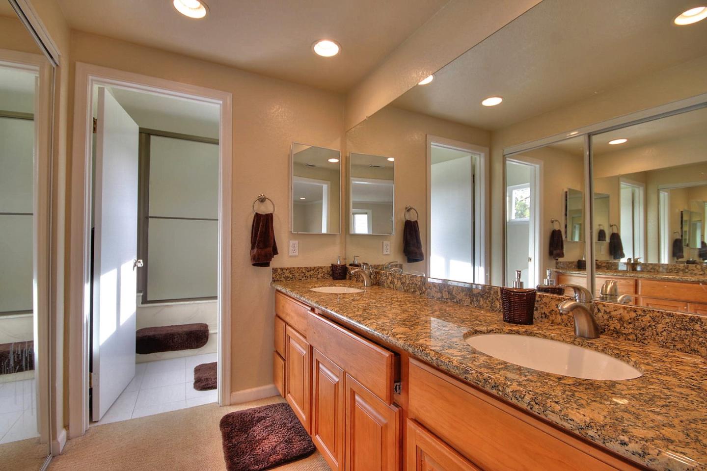 761 Superior Road Milpitas, CA 95035 - Photo 17 of 41 a bathroom with a granite countertop sink and a mirror