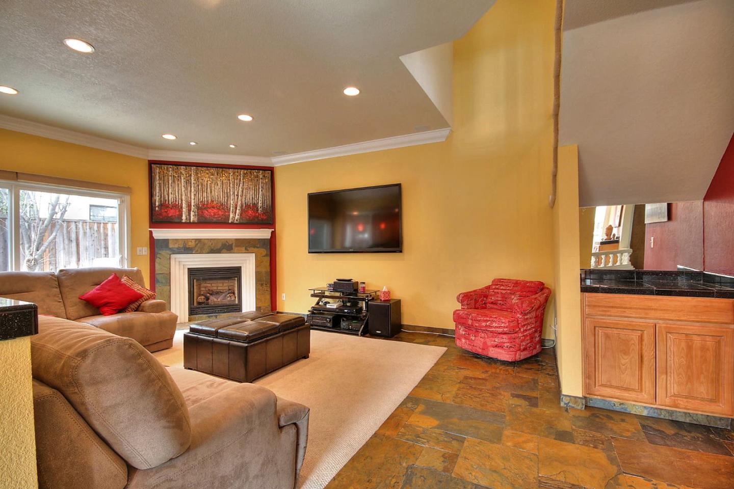 761 Superior Road Milpitas, CA 95035 - Photo 26 of 41 a living room with furniture a flat screen tv and a fireplace