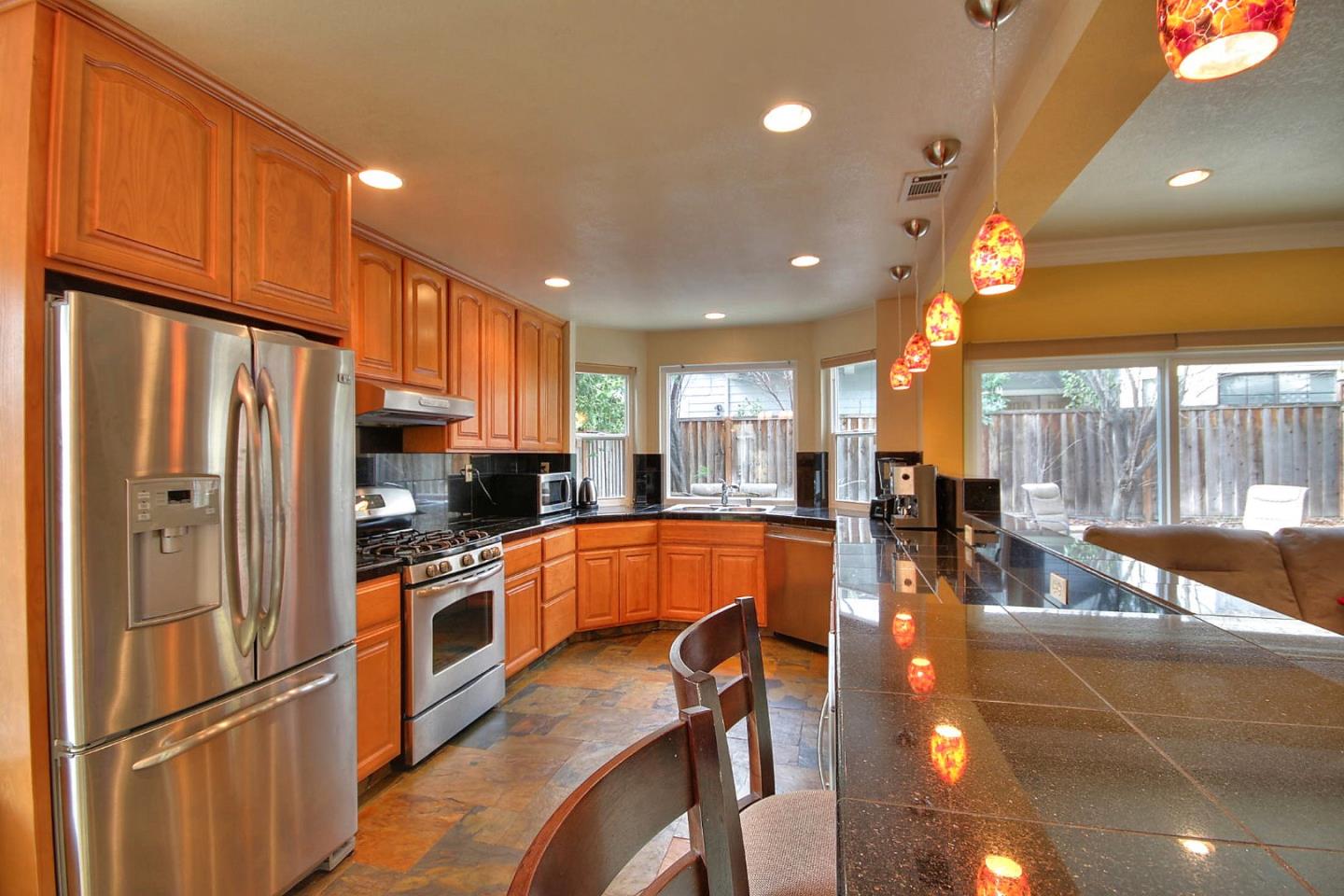 761 Superior Road Milpitas, CA 95035 - Photo 28 of 41 a kitchen with stainless steel appliances a refrigerator sink and cabinets