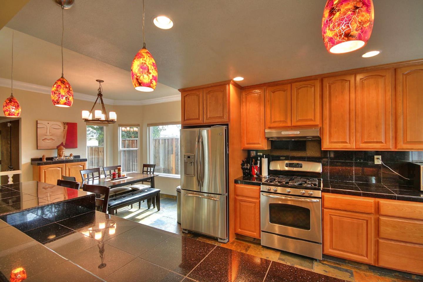 761 Superior Road Milpitas, CA 95035 - Photo 32 of 41 a kitchen with stainless steel appliances a stove a refrigerator and cabinets