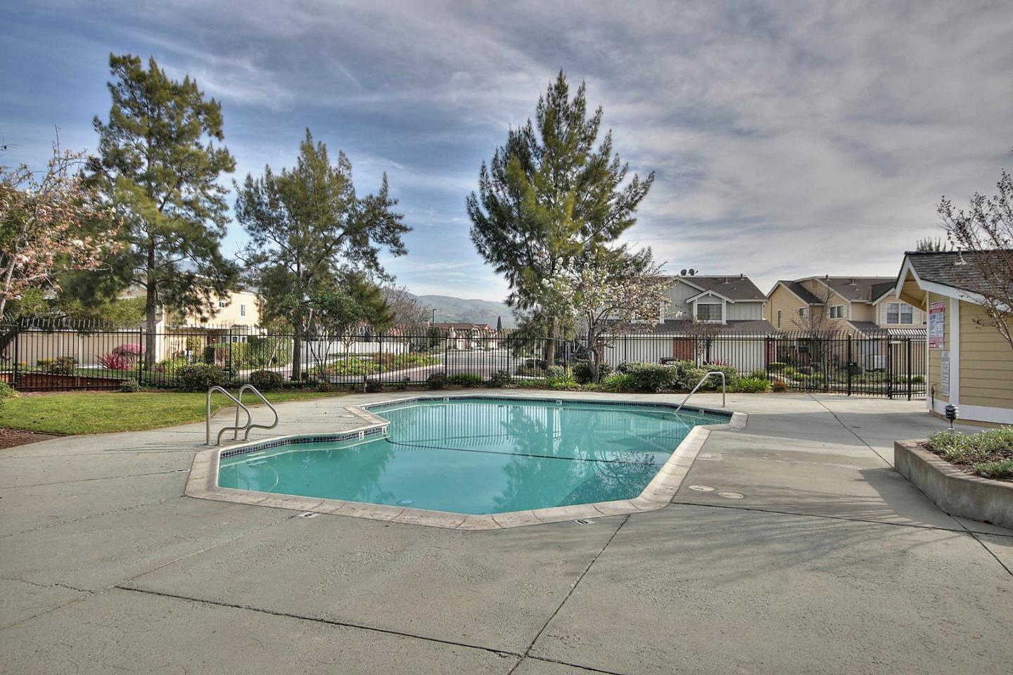 761 Superior Road Milpitas, CA 95035 - Photo 38 of 41 a view of outdoor space with swimming pool and trees in the background
