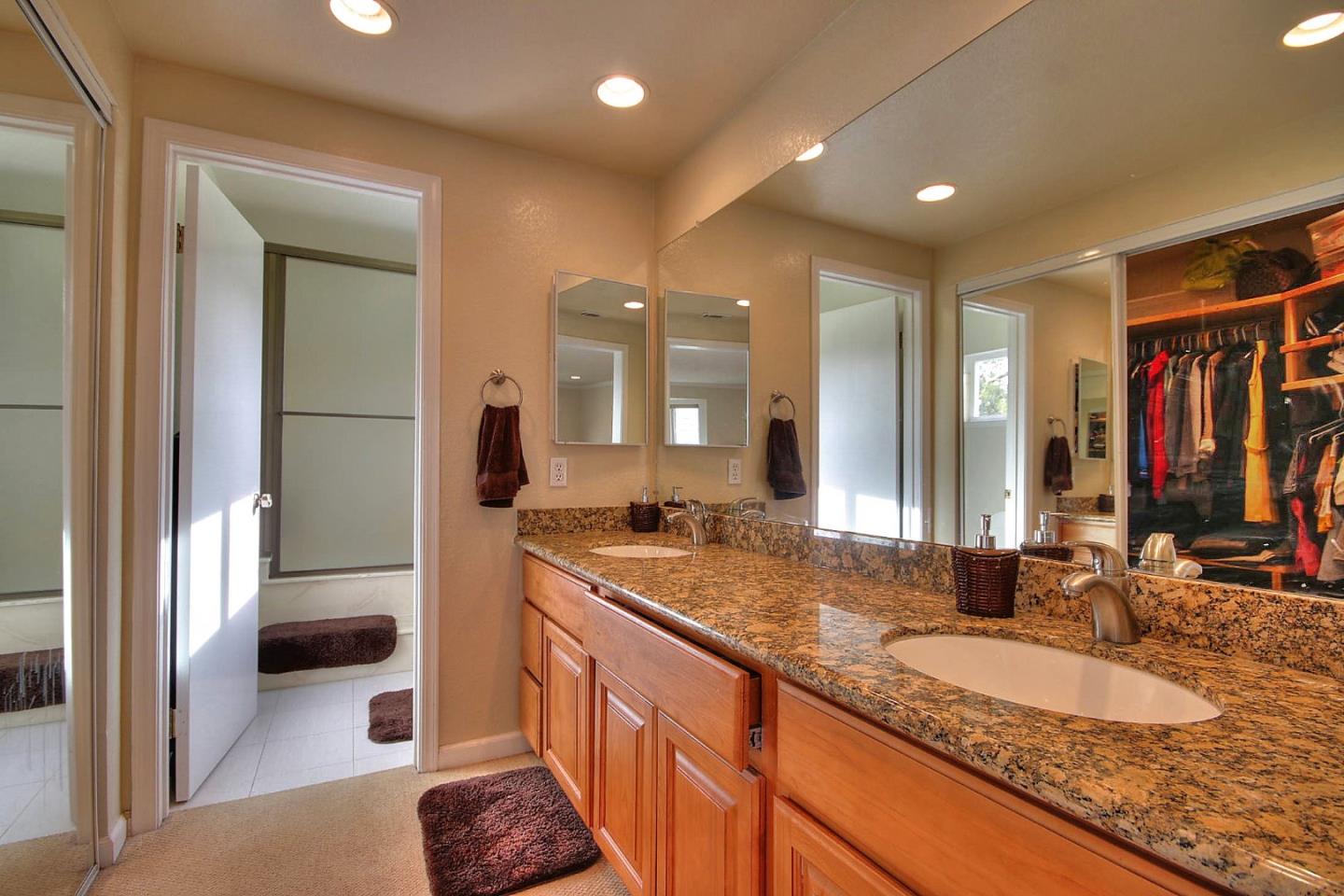 761 Superior Road Milpitas, CA 95035 - Photo 4 of 41 a bathroom with a granite countertop sink and a mirror