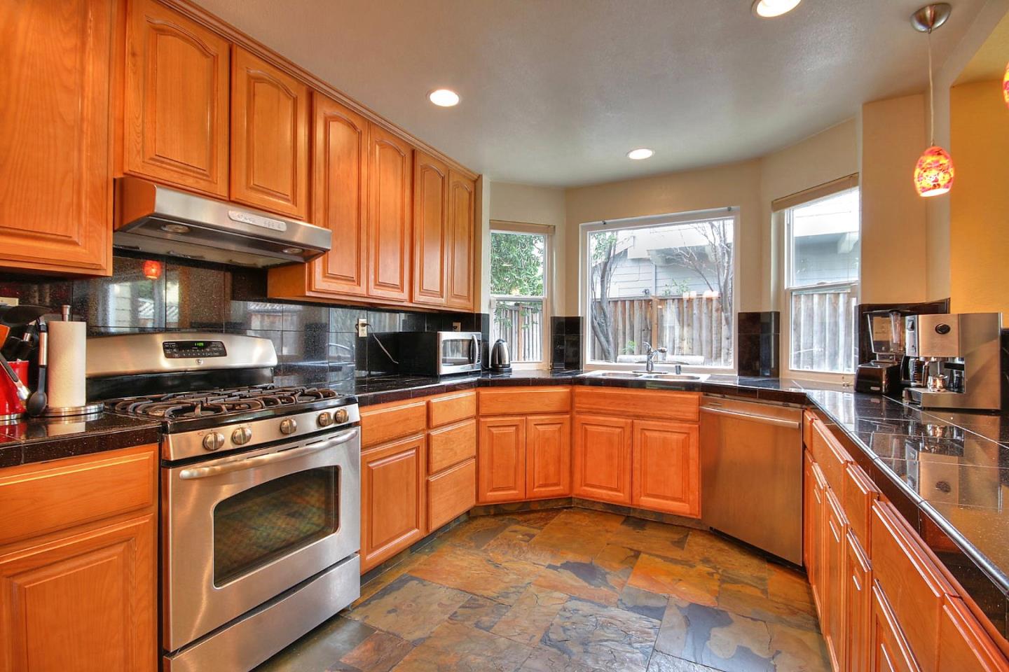 761 Superior Road Milpitas, CA 95035 - Photo 6 of 41 a kitchen with stainless steel appliances granite countertop a stove a sink and a refrigerator