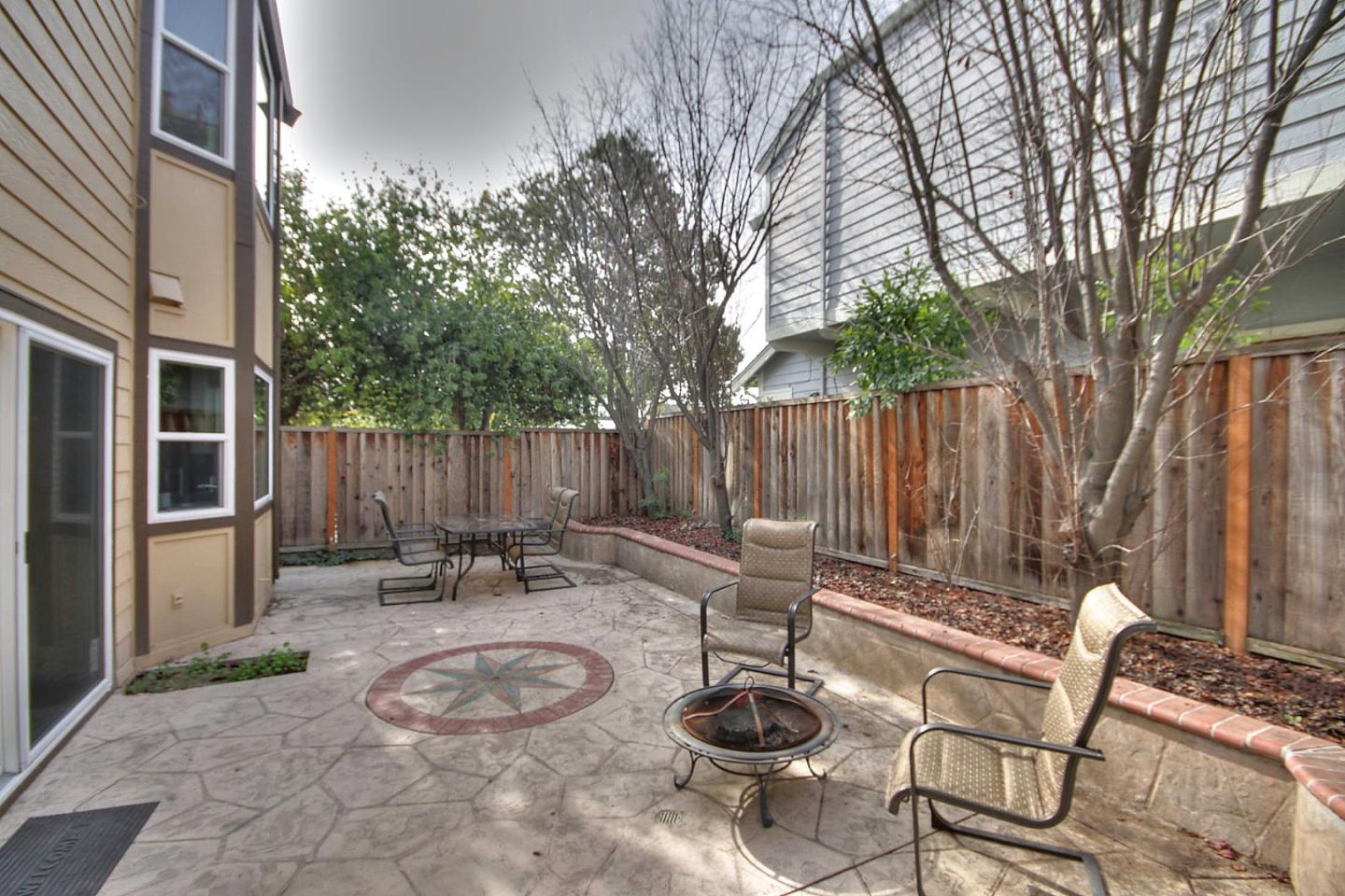 761 Superior Road Milpitas, CA 95035 - Photo 7 of 41 a backyard with table and chairs and a fire pit