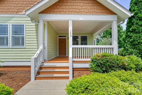 a front view of a house with a porch